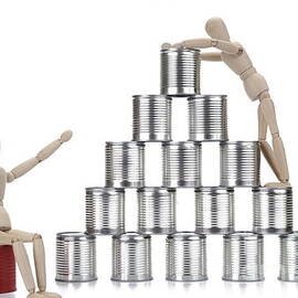 Wooden mannequin and tin cans by Sami Sarkis Photography