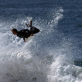 airborne at the wedge by Joe Schofield