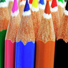 Bunch of standing colorful crayons by Sami Sarkis Photography