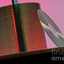 CD leaning against stack of CD's by Sami Sarkis Photography