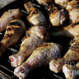 Chicken drumsticks on a barbecue by Sami Sarkis Photography