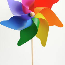 Colorful windmill on white background by Sami Sarkis Photography
