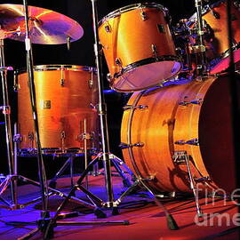Drum kit illuminated on stage by Sami Sarkis Photography