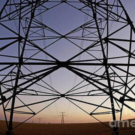 Electricity pylons at sunset by Sami Sarkis Photography