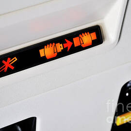 Fasten Seat belt and no smoking signs in airplane by Sami Sarkis Photography