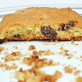 Half cookie and crumbs in plate by Sami Sarkis Photography