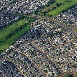 Housing development and highway by Sami Sarkis Photography