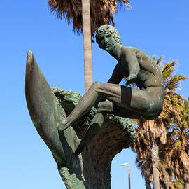 Huntington Beach Surfer Statue by Paul Velgos