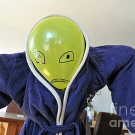 Kid in dad bathrobe hiding face with balloon by Sami Sarkis Photography