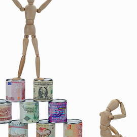 Mannequins on a banknotes pyramid by Sami Sarkis Photography