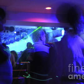 People dancing and light effects in discotheque by Sami Sarkis Photography