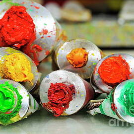 Row of paint tubes at painter's workshop by Sami Sarkis Photography