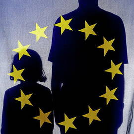 Silhouettes behind European Union Flag by Sami Sarkis Photography