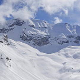 Snowy mountains and valley in winter by Sami Sarkis Photography
