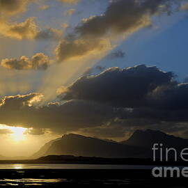 Sunset on mountains and ocean by cloudy day by Sami Sarkis Photography