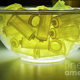 Syringes pump parts in bowl by Sami Sarkis Photography