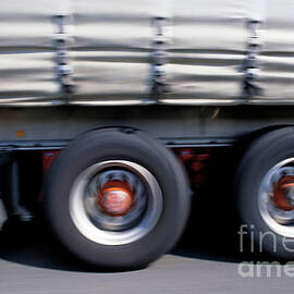 Truck driving on road by Sami Sarkis Photography
