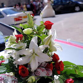 Wedding bouquet on car by Sami Sarkis Photography