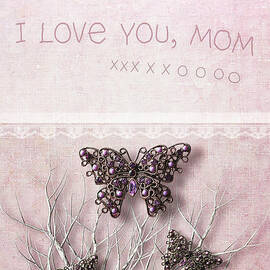 Butterfly pendants on branches by Sandra Cunningham