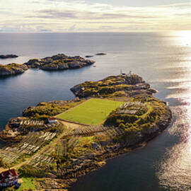 Football field in Henningsvaer from above by Miroslav Liska