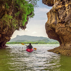 Kayaking under high cliffs in Thailand by Miroslav Liska
