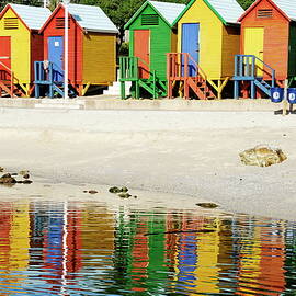 Multicoloured beach huts on Muizenberg beach by Sami Sarkis Photography