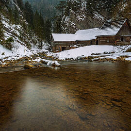 Old wooden water mill in winter by Miroslav Liska