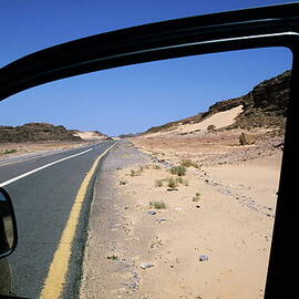 Road  view through car door window by Sami Sarkis Photography