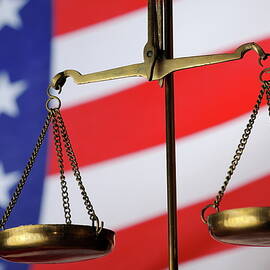 Scales of Justice and American flag by Sami Sarkis Photography