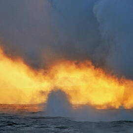 Steam rising off lava flowing into ocean at sunset by Sami Sarkis Photography