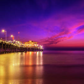 Sunset with many tourists at Santa Monica Pier in Los Angeles by Miroslav Liska