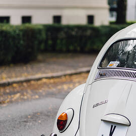Volkswagen Beetle retro car at the city street by Aldona Sate