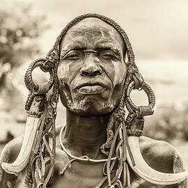 Warrior from the african tribe Mursi, Ethiopia by Miroslav Liska
