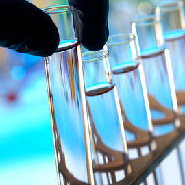 Laboratory Test Tubes in Science Research Lab by Olivier Le Queinec