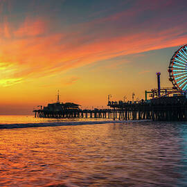Visitors enjoy sunset above Santa Monica Pier in Los Angeles by Miroslav Liska