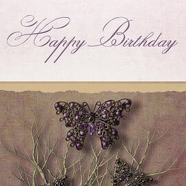 Butterfly pendants on branches by Sandra Cunningham