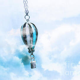 Abstract air baloon hanging on chain by Jorgo Photography