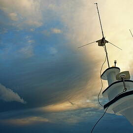 Antennas of a diver's cruise boat at sunset by Sami Sarkis Photography