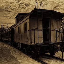 Antique Iron Range Caboose by Dale Kauzlaric