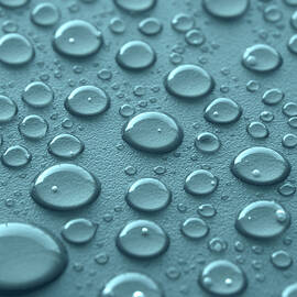 Blue water drops by Blink Images