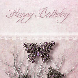 Butterfly pendants on branches by Sandra Cunningham