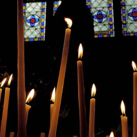Candles burning inside the Basilica of the Saint Sauveur by Sami Sarkis Photography