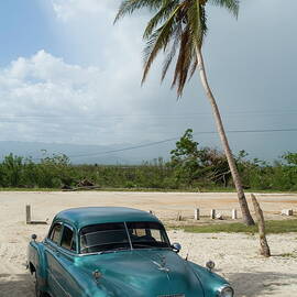 Classic American car parked at Ancon Beach by Sami Sarkis Photography