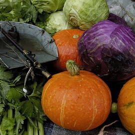 Colorful fresh vegetables and a weight scale at a street market by Sami Sarkis Photography