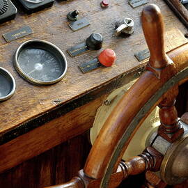 Controls and steering wheel of a dive boat by Sami Sarkis Photography