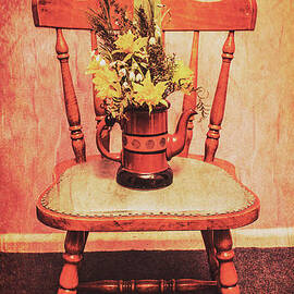 Decorated flower bunch on old wooden chair by Jorgo Photography