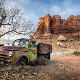 Deserted Dodge pickup vehicle parked near Twin Rocks trading post in Bluff, Utah by Miroslav Liska
