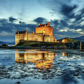 Eilean Donan Castle in Scotland during blue hour by Miroslav Liska