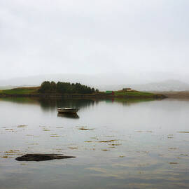 Empty boat floating on a lake by Miroslav Liska
