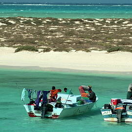 Fishermen on their boats by Sami Sarkis Photography